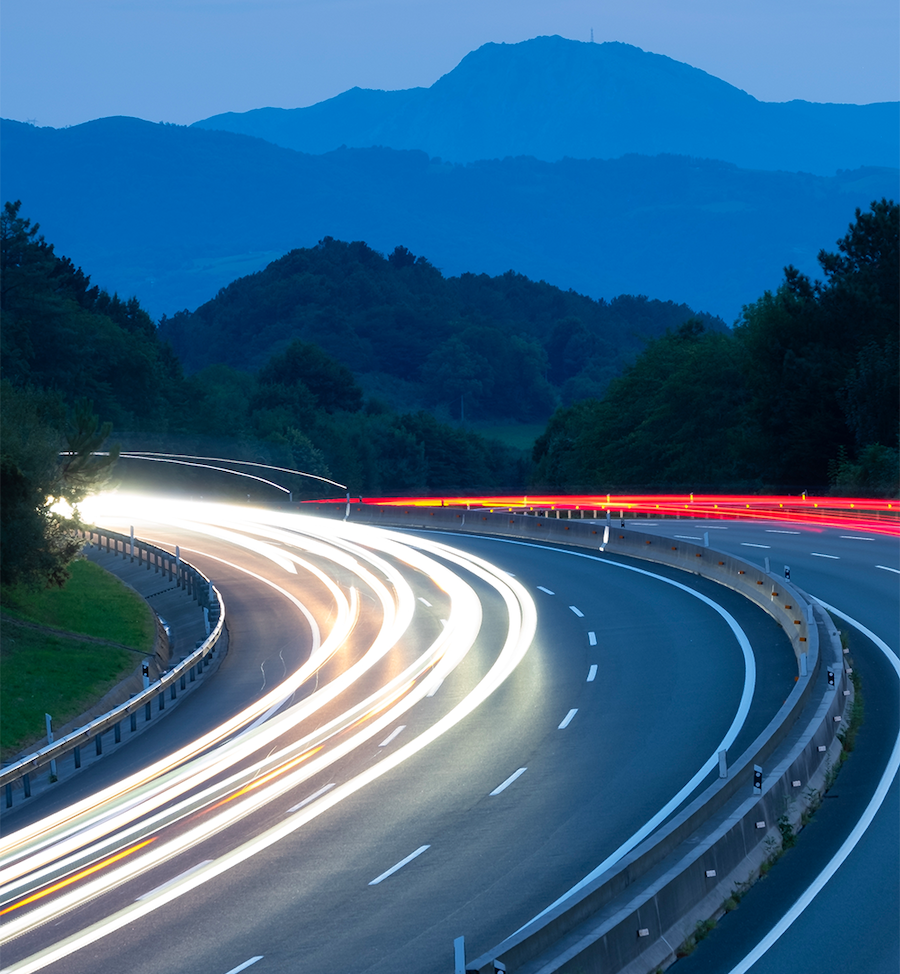 Cars moving at sunset