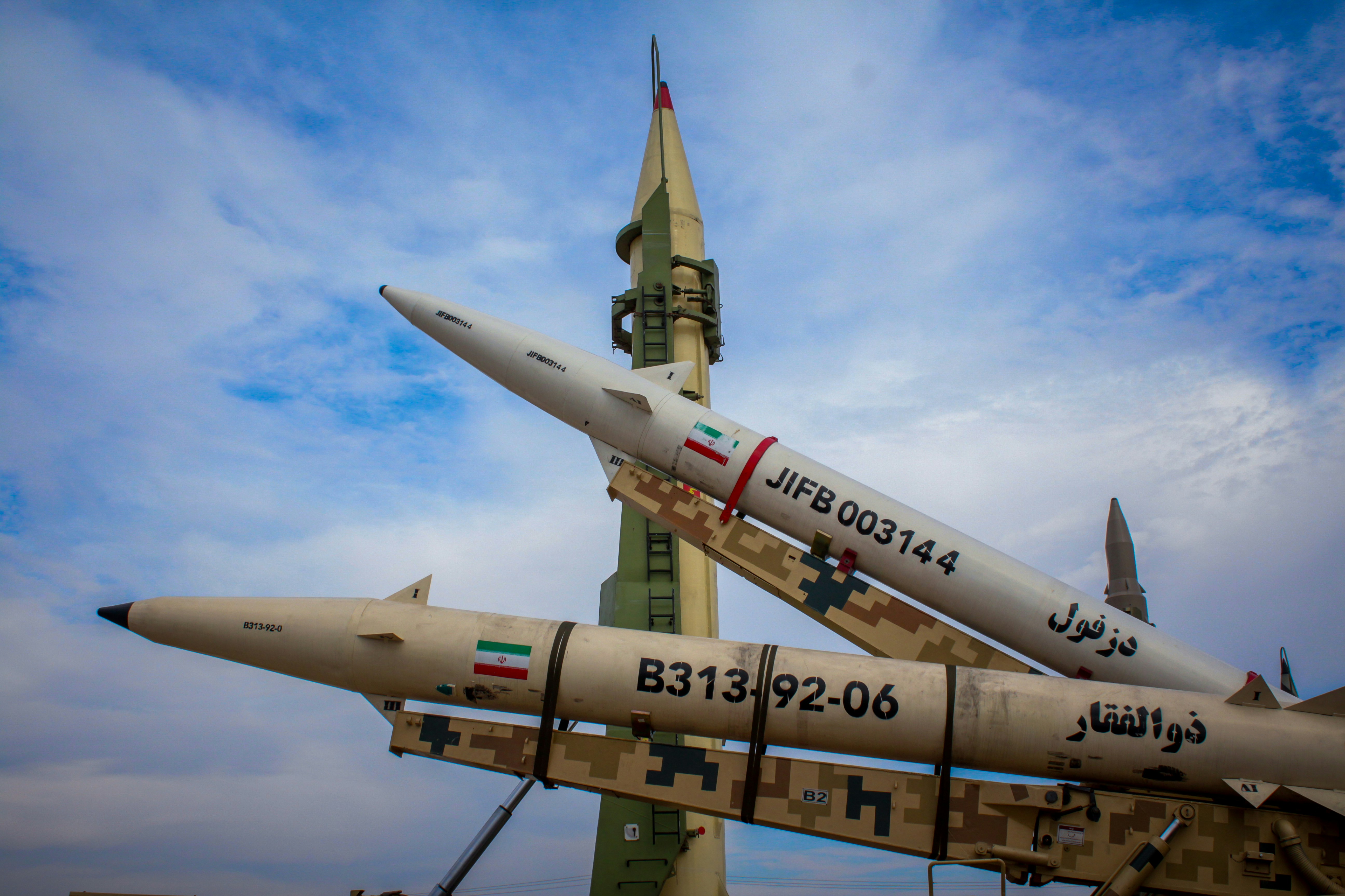 Precision-guided missiles positioned against a clear sky