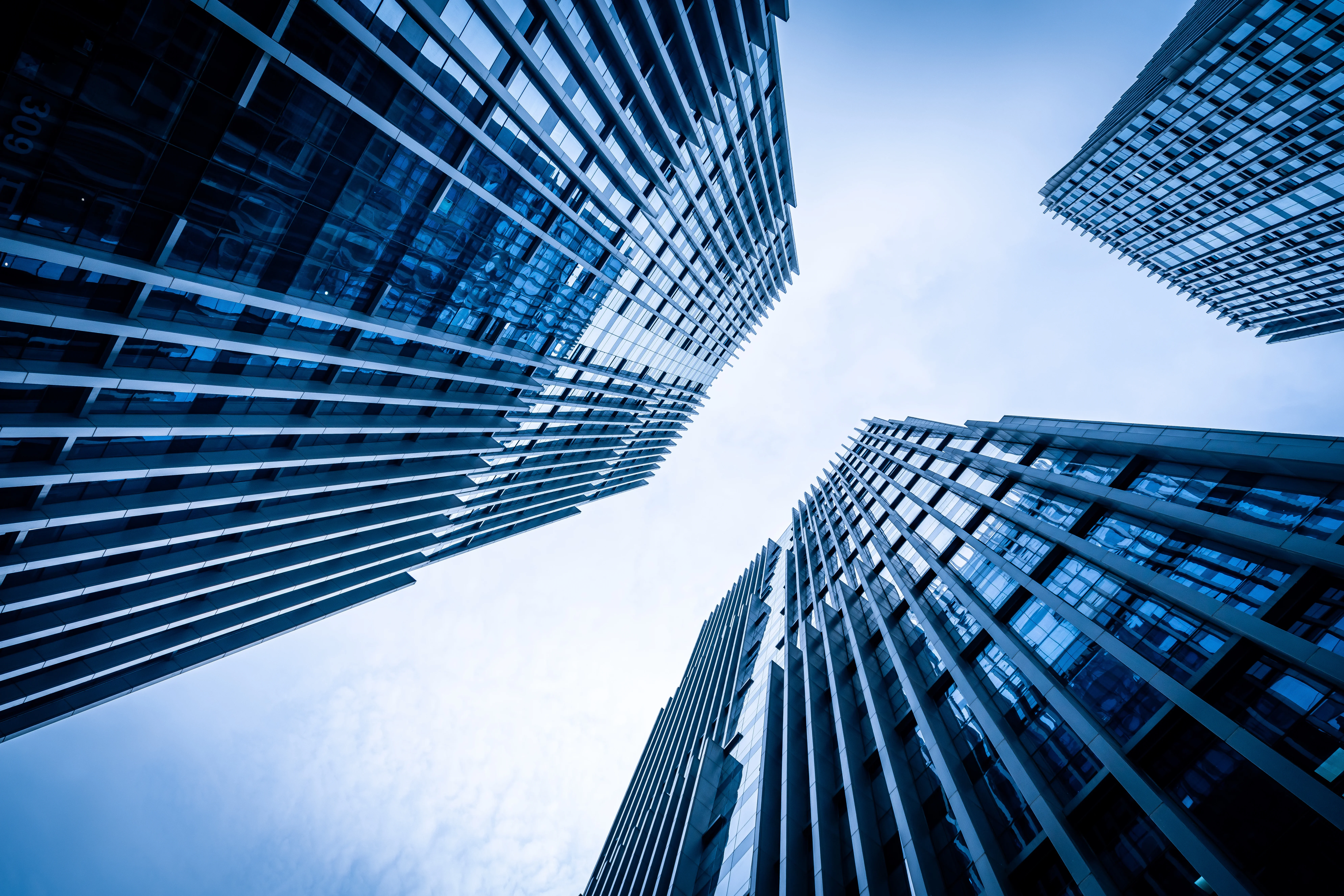 Looking up at glass skyscrapers