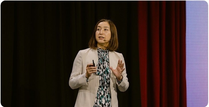 Speaker presenting at a conference