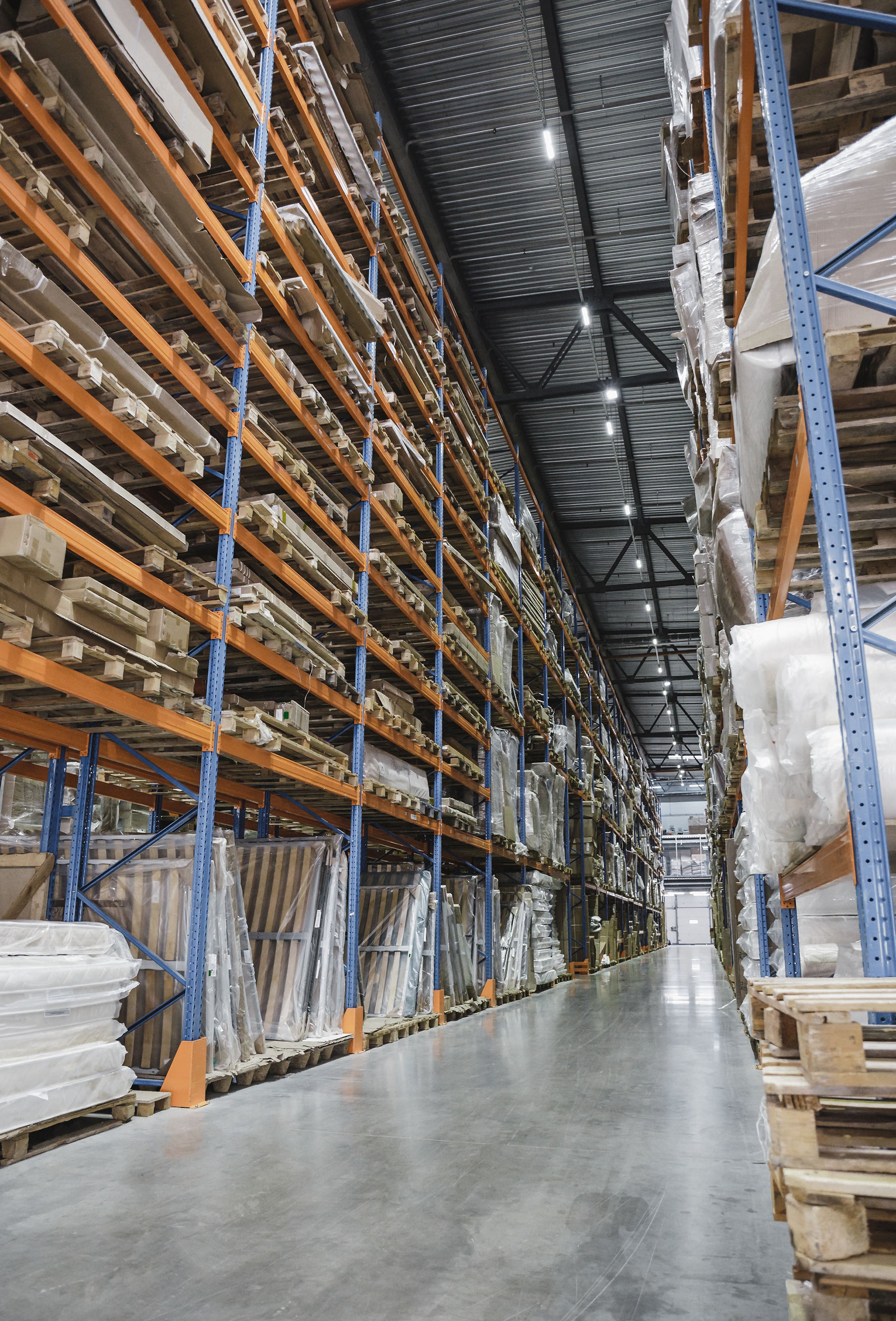 Worker in a large warehouse