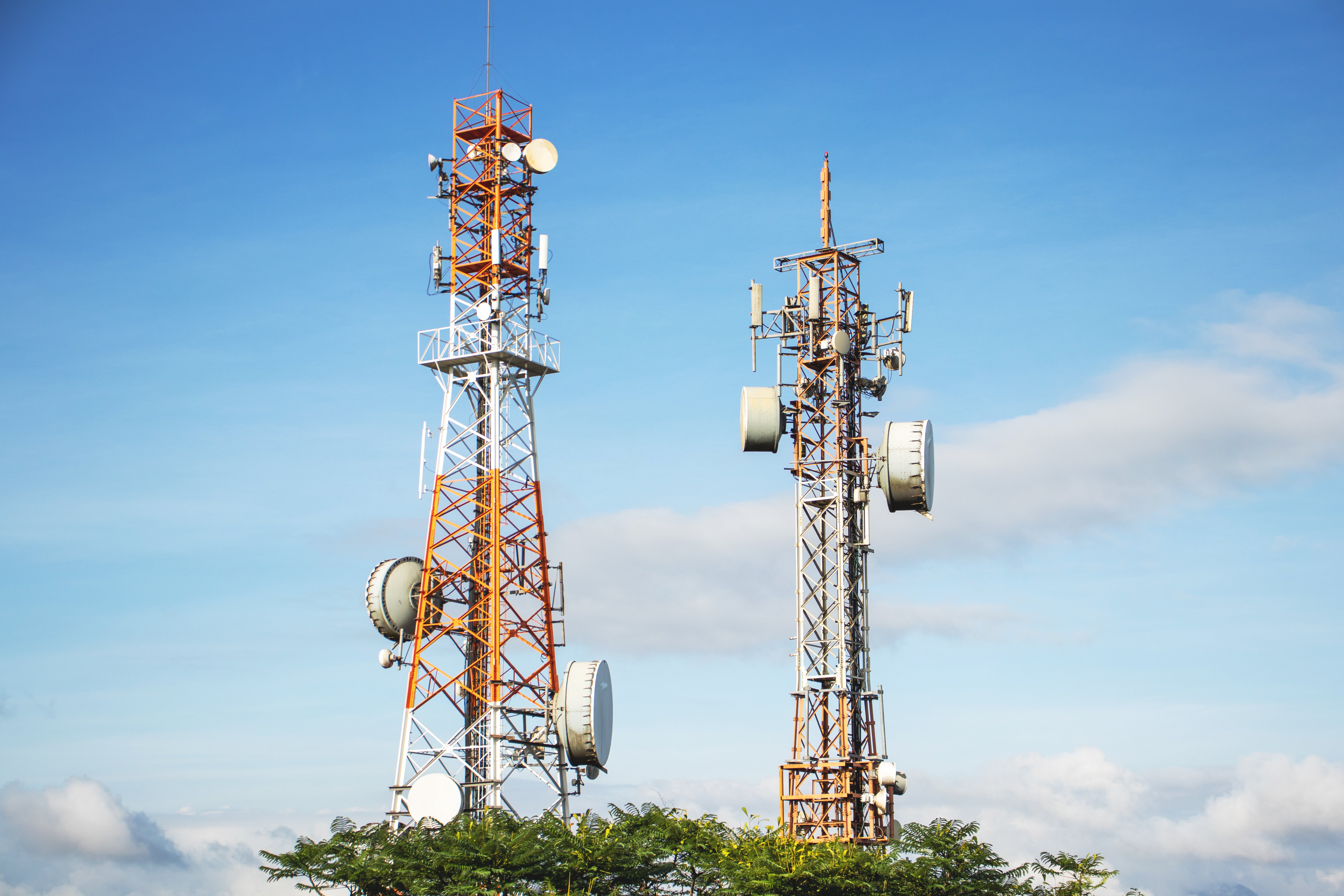 Telecommunications towers against a blue sky
